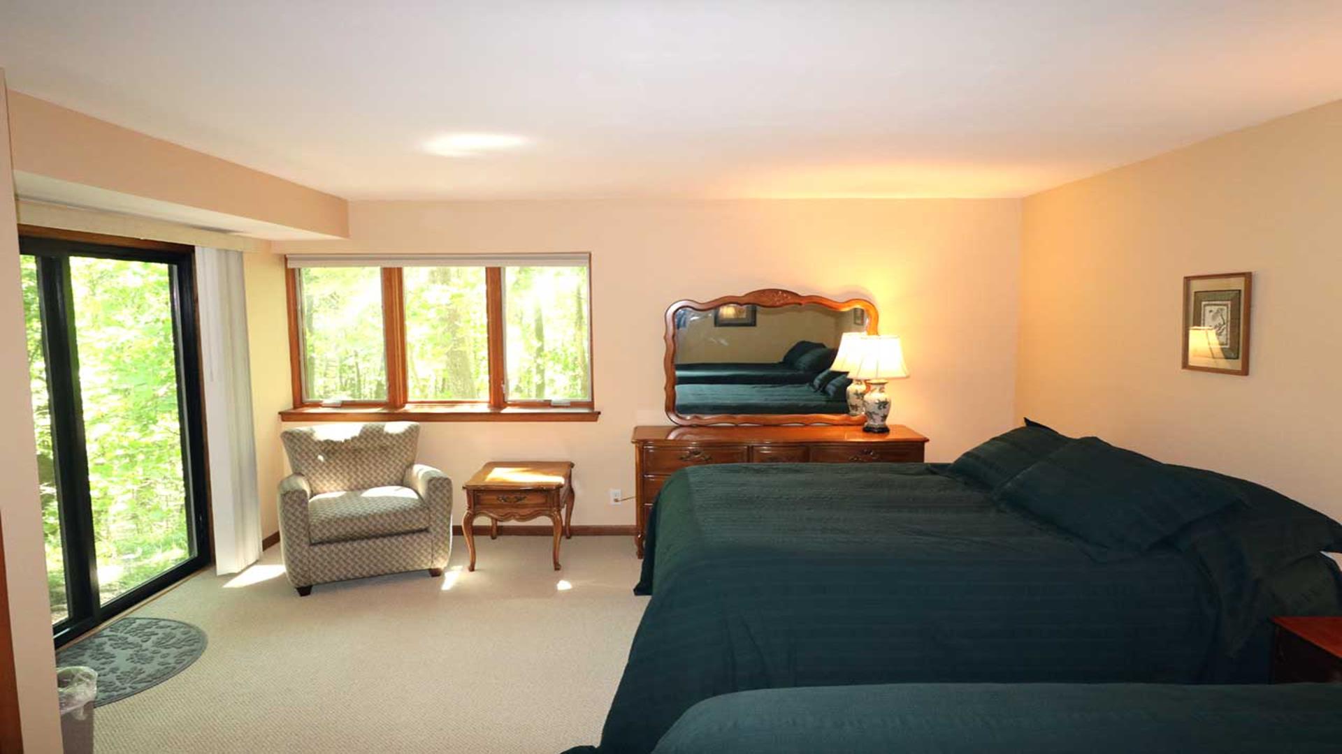 Lower level bedroom with two queen beds