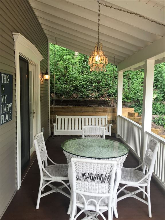 Covered Front Porch With Inviting Gathering Areas